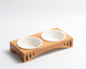 Two white ceramic bowls set into a raised bamboo arch frame with cut-out sides