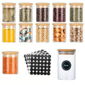 Twelve round glass spice jars with bamboo lids, shown with the included label stickers